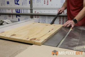 breaking down plywood on the table saw cordless power tool storage shelf