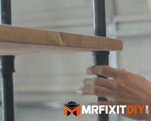 assembling black pipe bookshelf