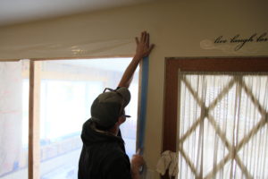 sealing off work area with plastic 