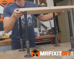 assembling black pipe bookshelf