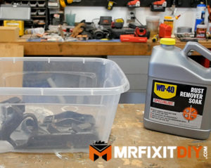 soaking hand plane parts in WD40 rust remover soak